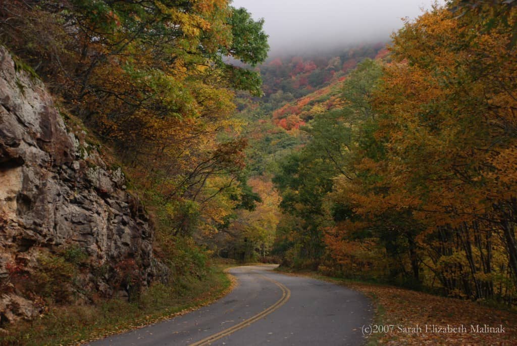autumn mountain road wlow lying clouds