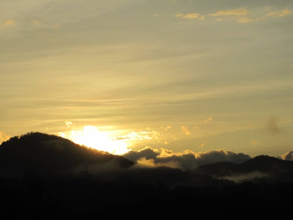 Sun breaking over Mountains, Mist, Sunset