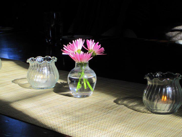 pink-flowers-and-tea-candles-on-table
